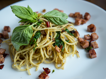 Stir fried spaghetti with dried chili and baconの写真素材
