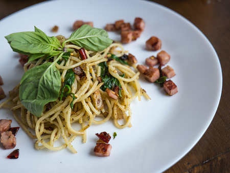 Stir fried spaghetti with dried chili and baconの写真素材