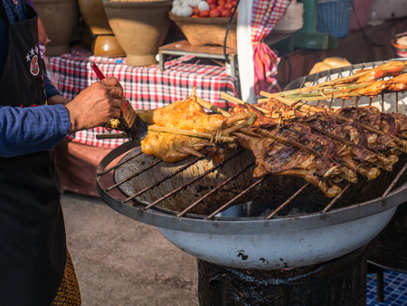 Roast chicken in Thai local marketの写真素材