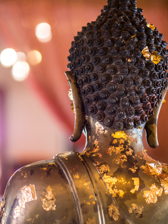 Back of Buddha statue in Thai templeの写真素材
