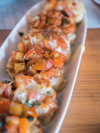 Homemade Bruchetta, toasted Italian bread with tomato and cheeseの写真素材