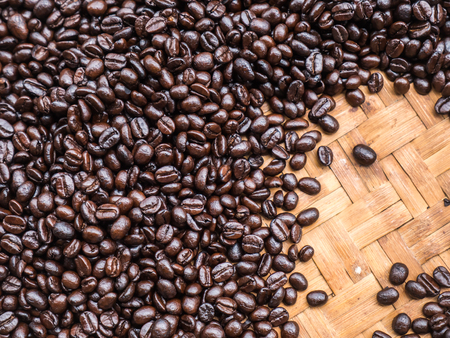 Black coffee bean on wood basketの写真素材