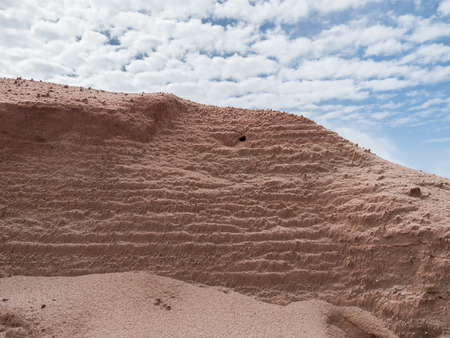 Natural sand wall and blue sky backgroundの写真素材