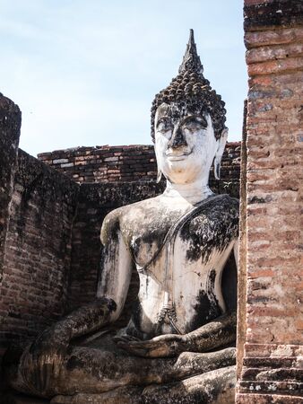Ancient Buddha statue in Sukhothai historical park, landmark in Thailandの写真素材