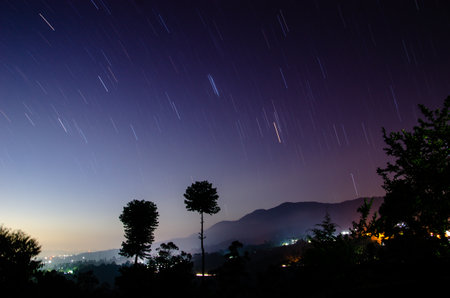 Night scene recorded for 904 seconds. You can clearly see the rotation of the stars in the sky.の写真素材