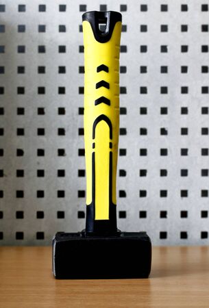 Sledge hammer with rubberized yellow handle, vertical standの写真素材