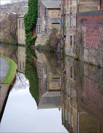 Canalside Buildings Reflected In Calm Water At Shipley West Yorkshire の写真素材