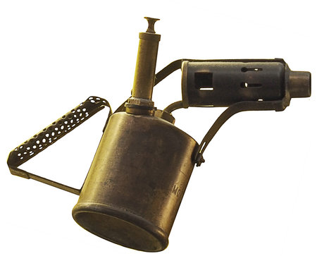 A vintage paraffin fired brass blowlamp isolated on a white background.の写真素材
