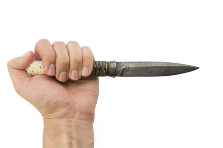 A hand holding a Thai knife isolated on white backgroundの写真素材