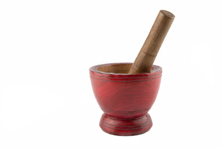 Wooden mortar and pestle isolated on white backgroundの写真素材