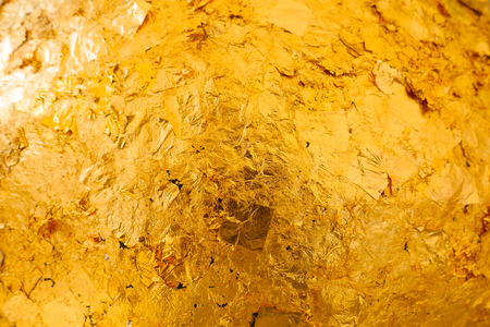 Gild texture on gold buddha statue background, Which Buddhist people use to worship The sacredの写真素材