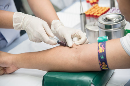 Blood sample from a vein, Nurse taking Real Blood samples analysis from a vein of the patient,...