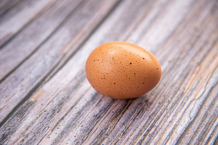 Close-up view of raw chicken eggs on white background. Eggs are often said to be the original...