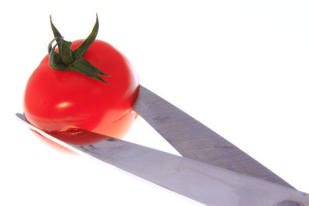 cocktail tomato and scissorsの写真素材