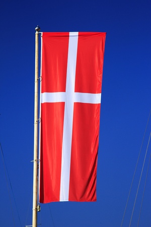 Flag of Denmark before blue skyの写真素材