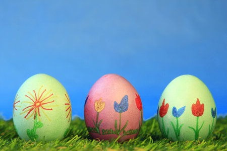 Three colorful painted Easter eggs