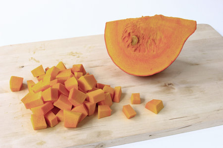 Hokkaido pumpkin, cut and diced  Cucurbita maxima の写真素材