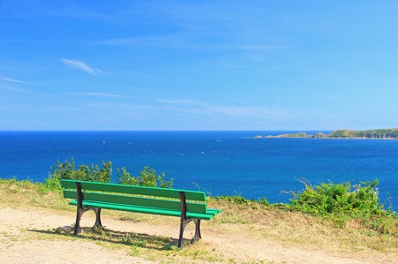 Viewpoint with green bench in Perros-Guirec, Brittany, English Channel, Franceの写真素材