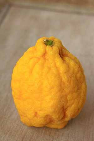 Citron (Citrus medica) on an old board
