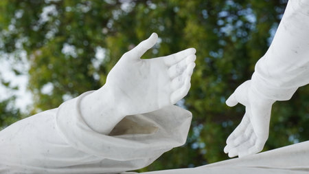 Angels of white marble tombstones in graveyard in Havana Cubaの写真素材