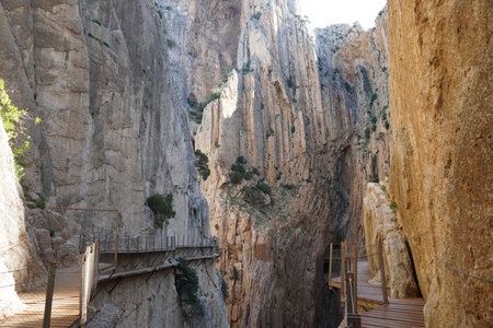 Hiking trail Caminito del Rey, Kings Walkway, in Malaga Spain, narrow footpath leads through natural beauty mountain range cliff faces of Gaitanes Gorge, hisotric landmark popular tourist attractionの写真素材