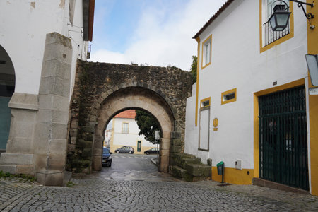 Discovering the narrow and picturesque streets of Evora, Portugal, featuring the famous whitewashed...