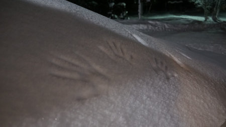 Frozen hands on snow from the beautiful town of Saariselka in Lapland