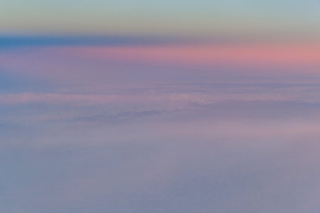 Abstract cloudscape at sunset photographed from above the clouds in an aeroplane