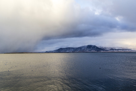 Weather bomb storm and mountainscape / landscape with water in Reykjav?k, Iceland.の写真素材