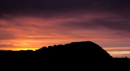 Sunset at Beeston Bump in Norfolk in orange and purple.の写真素材