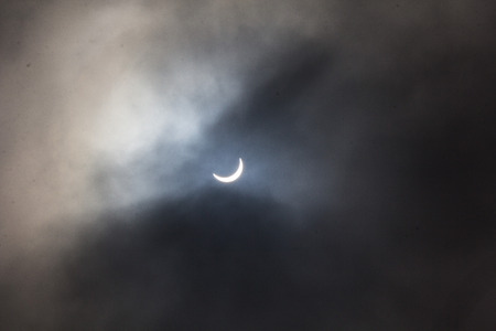 Photo of the solar eclipse through cloud on 20th March 2015の写真素材