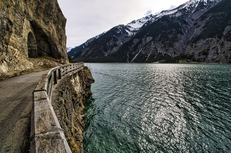 Blue lake with a mountain landscape in the background