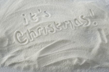 Its Christmas drawn by hand in snowの写真素材
