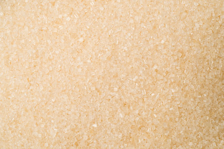 A close of of golden granulated sugar
