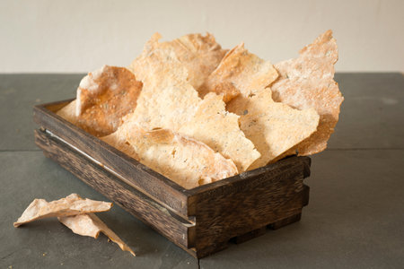 A wooden box with handmade crisp flatbreads