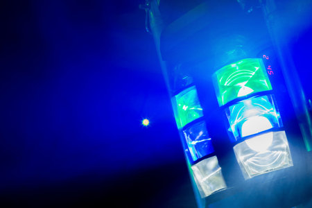 Multi colored disco nightclub lighting shot in a dark room with smoke