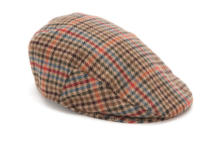Cutout of a checked houndstooh tweed hunting hat or flat cap.