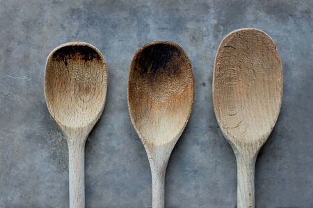 Heads of three wooden spoons of different sizesの写真素材