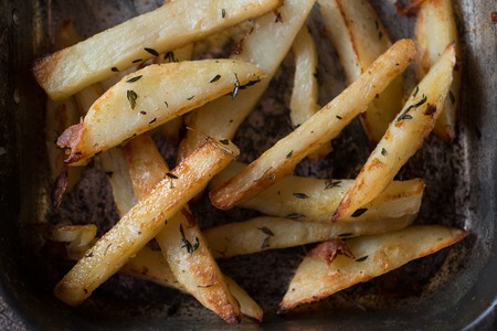 Closeup of baked chips in an iron baking trayの写真素材