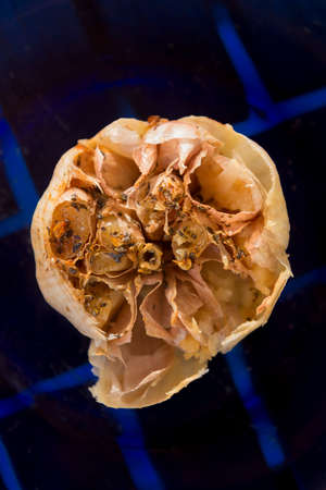 Overhead close up of a gourmet backed garlic bulbの写真素材