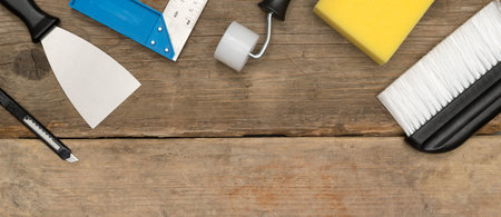 Banner photo of home improvement or construction tools on wooden surface with copy space