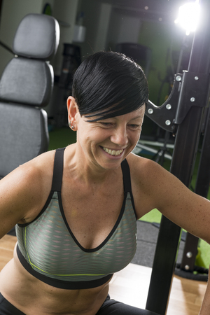 Fit and muscular pixie-haired brunette in a gymのeditorial素材