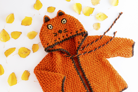 Knitted orange car hoodie for childrenの写真素材