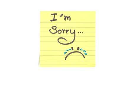 Top-view photo of small yellow stick note with sentence \\\"I\\の写真素材