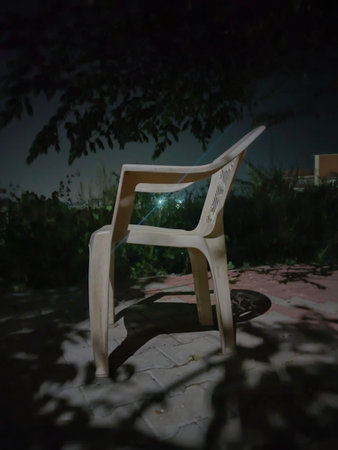 chair in the garden at night, closeup of photoの写真素材