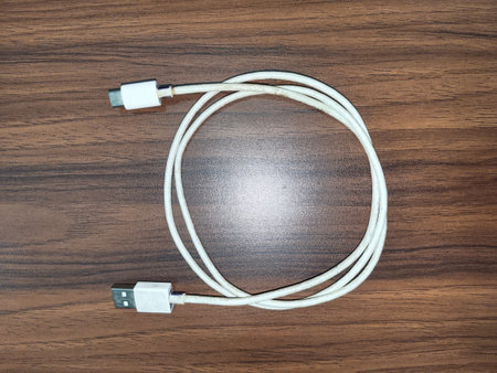 USB cable on the wooden background, can be used as a background