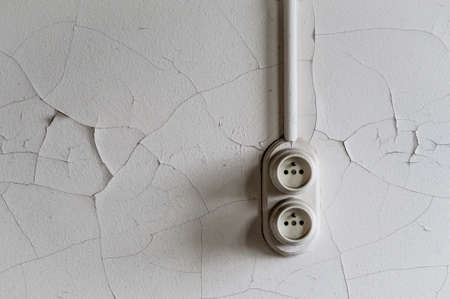 vintage pair of plug sockets at wall in ruinの写真素材