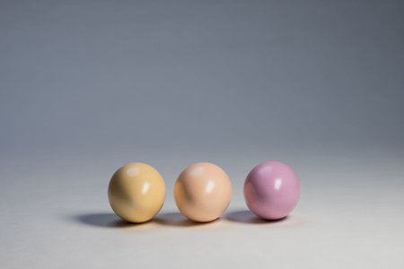 Arranged coloured easter eggs in studio