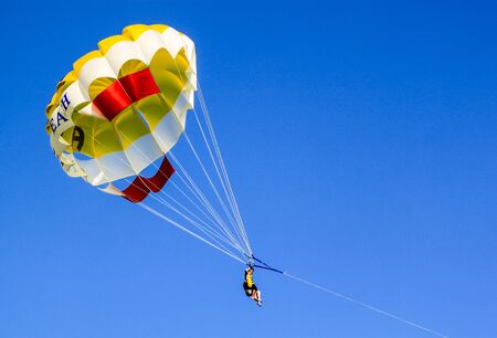 People enjoying a parashute paragliding experience.の写真素材
