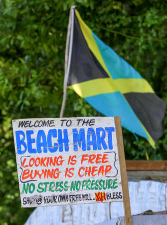 Jamaican flag at a beach market with sign.の写真素材